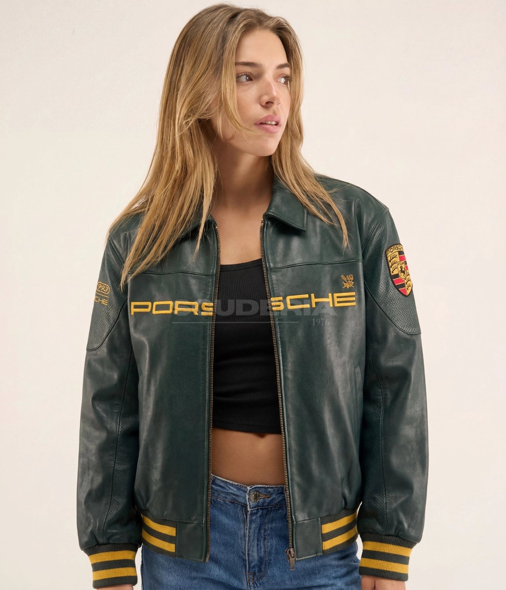 Aimé Leon Dore x Porsche 993 Turbo Leather Club Jacket green front view women – vintage racing leather bomber with gold embroidered Porsche logo, Porsche crest patch on sleeve, gold striped ribbed cuffs and hem