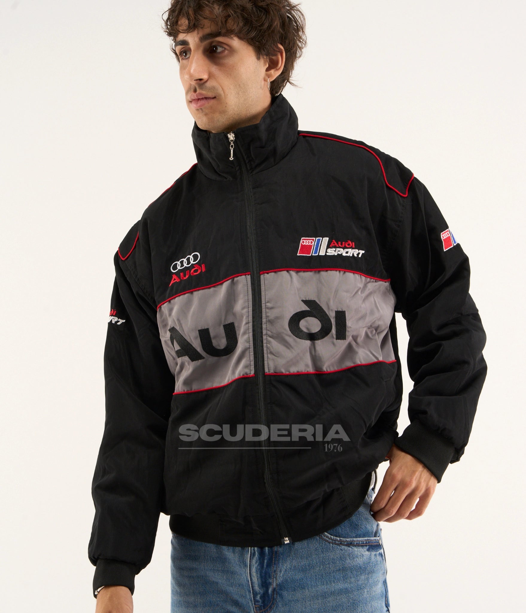 Scuderia 1976 Audi Vintage Racing Jacket black and grey front view studio shot with embroidered motorsport patches