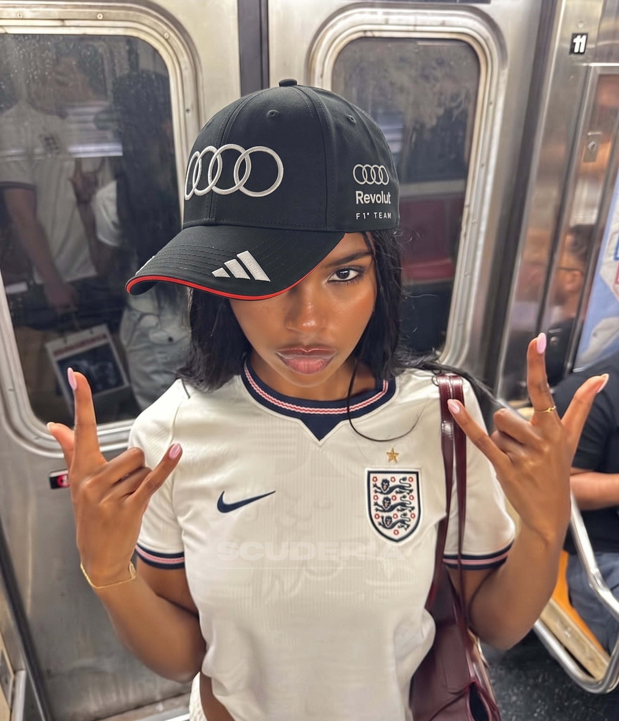 Woman wearing the Audi F1 2026 black cap on the subway