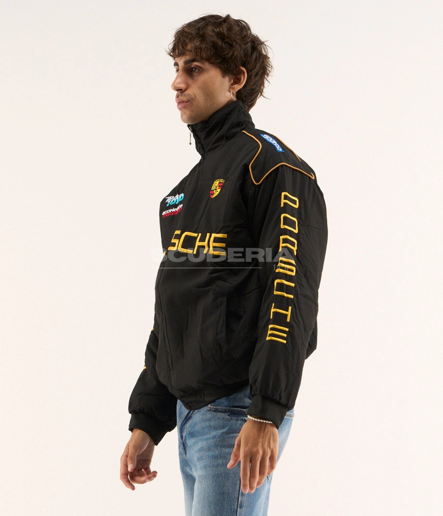 Porsche Vintage Racing Jacket black gold side view men – vintage padded bomber with gold embroidered Porsche logo, Porsche sleeve lettering, Sparco patch and gold piping trim detail