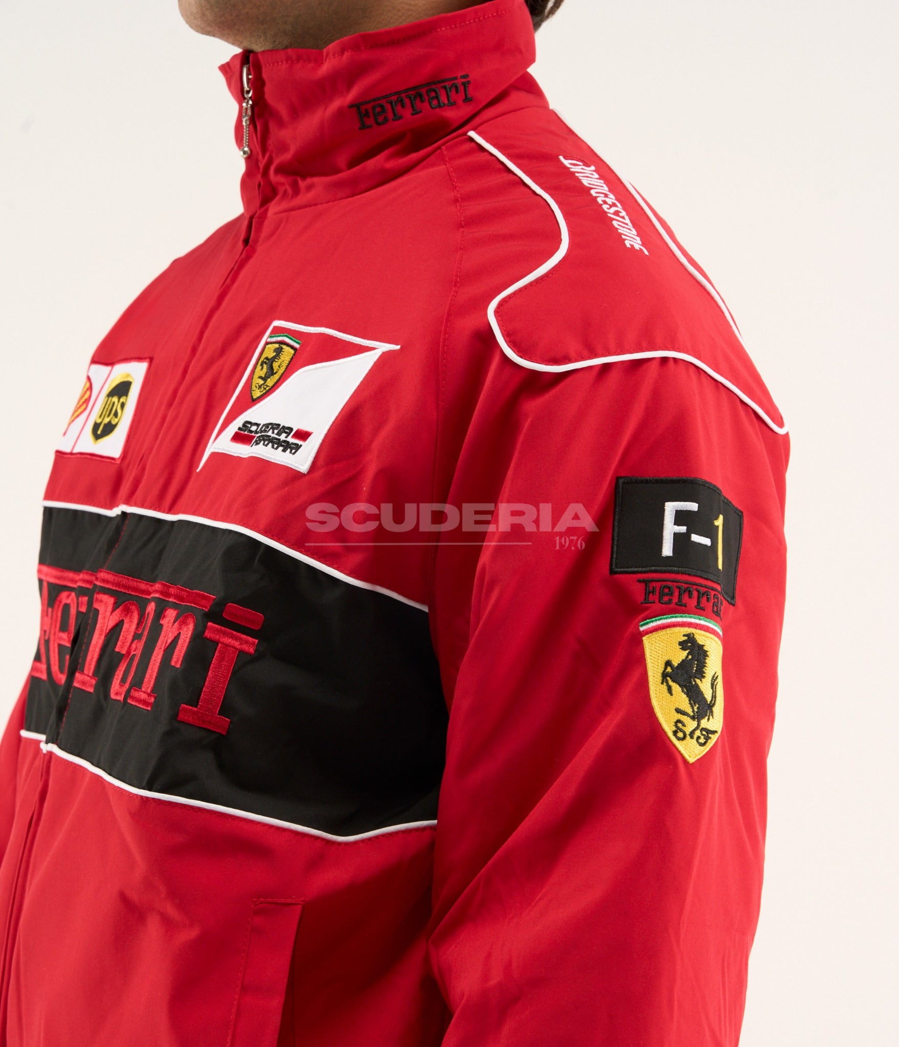 Close-up of Ferrari F1 Vintage Racing Jacket Red Edition showing sleeve patch and premium motorsport embroidery